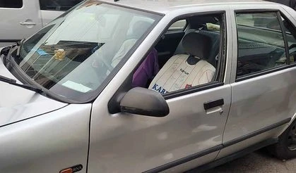 Aracın camını kırdı, kendini ihbar etti…